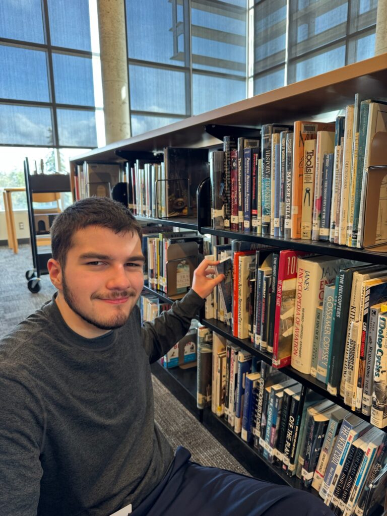 An OLS student at their library internship.