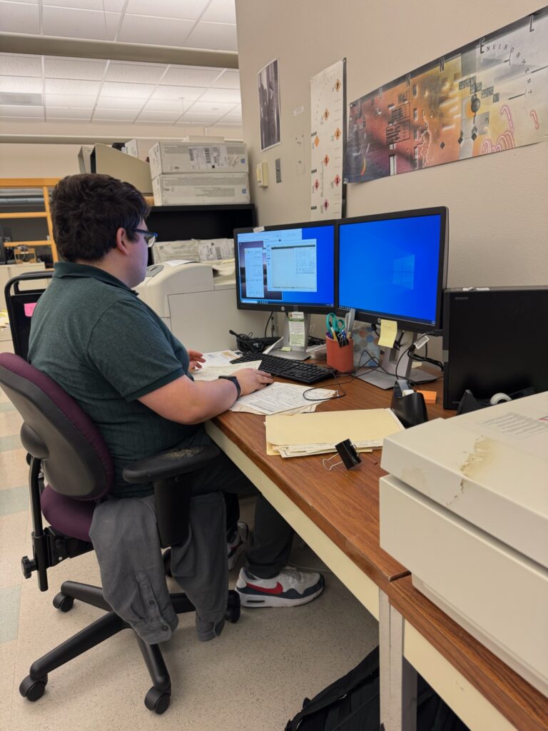 An OLS student working at a desk