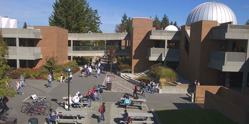 image showing a view of a section of the outdoor corridor populated with by community members