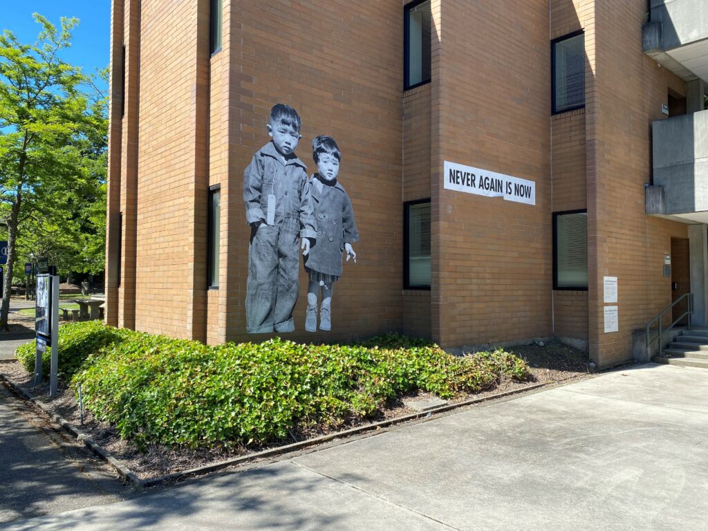 view of mural Never Again is Now by Erin Shigaki at one of the outdoor mural sites