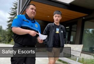 Officer Escorting Student White text Safety Escorts