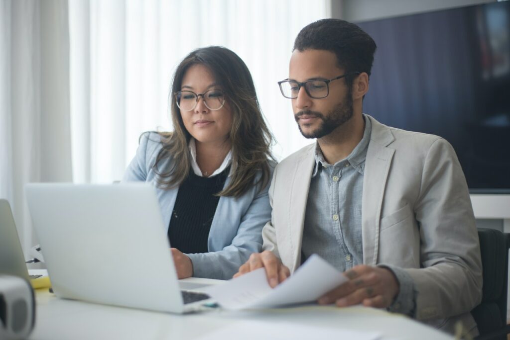 Parents sitting in front of a computer