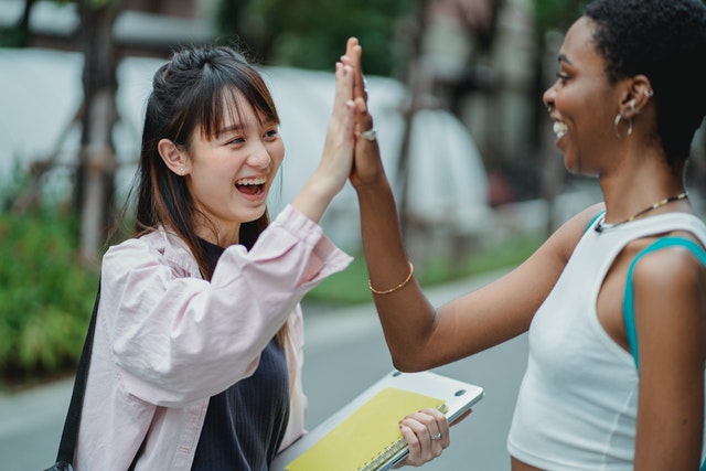 Picture of two international students is decorative only