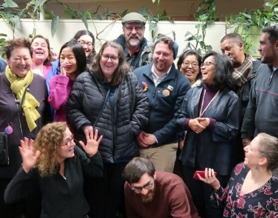 Rise Faculty gathered around for a group photo at the office.