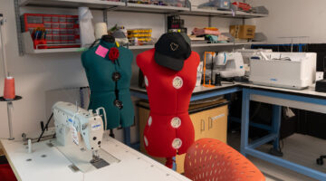 One of the sewing machines and some of the sewing tools, including two forms.