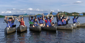 A group of students on a canoeing trip in Lake Washington