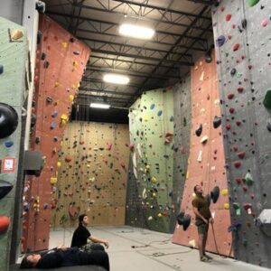 Vertical World interior with 2 climbers looking up at the walls