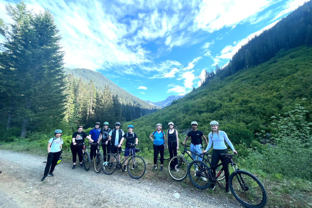Stopping to pose with bikes along the Palouse to Cascades Trail under blue skies with amazing clouds overhead.