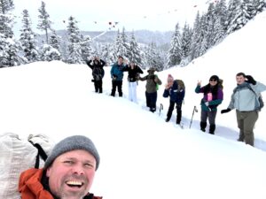 Peter Prescott on a snowshoe hike with Wellness students.