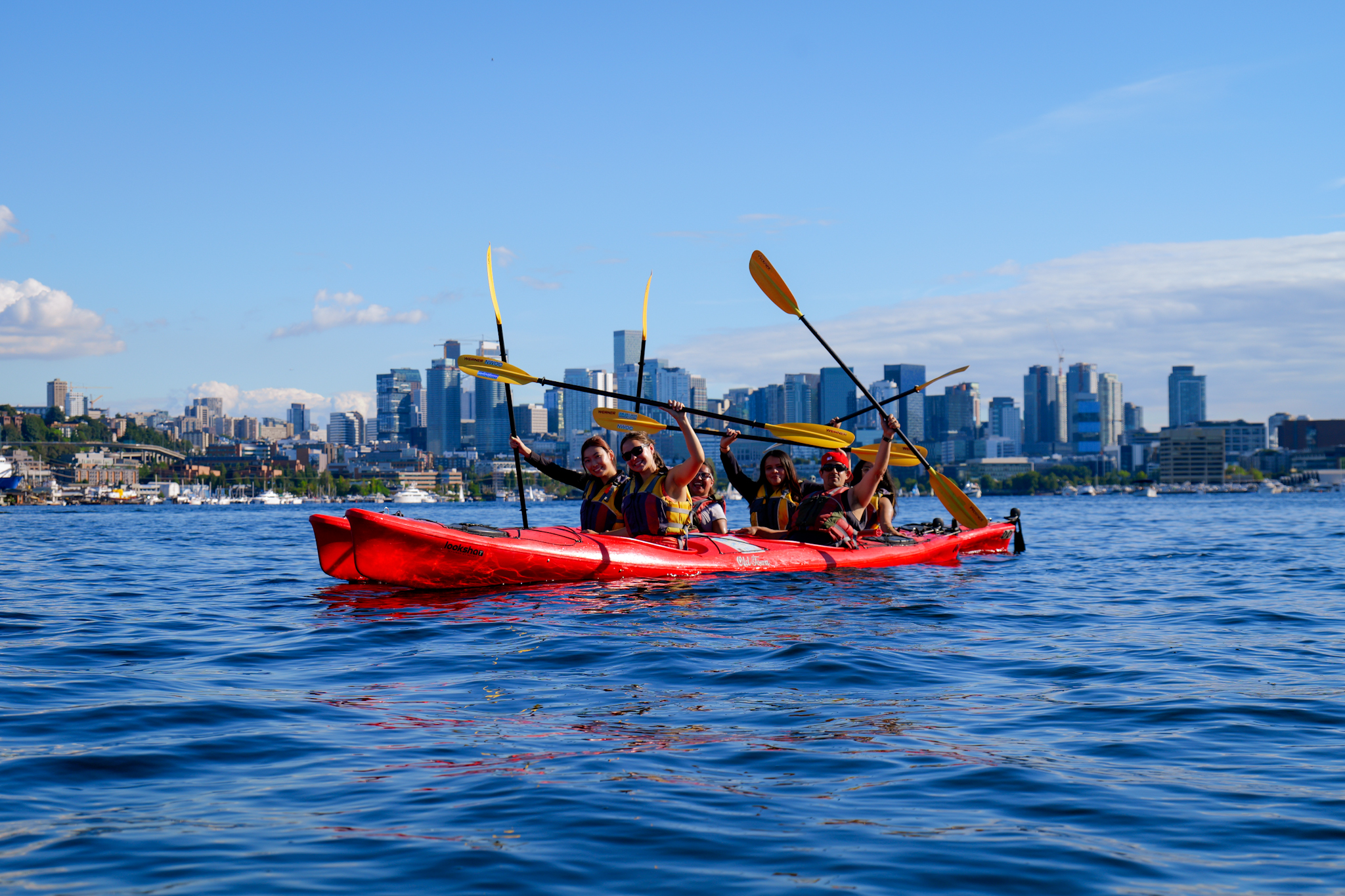 Kayaking on Lake Union with the Seattle skyline in the background.