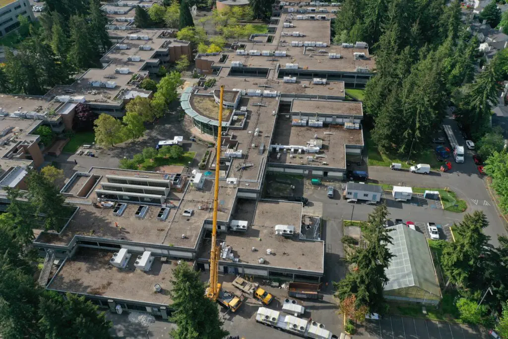 Aerial shot of the Bellevue College campus with a crane at the site of the new W Building. 