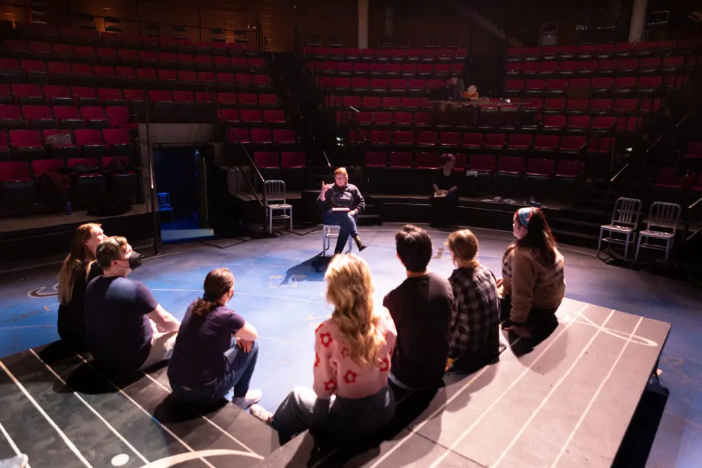 Students attend class in the Carlson Theatre.