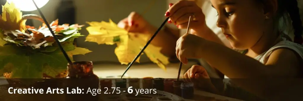a child paints creatively