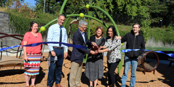 Gary Locke and Sheri Flies cut a ribbon to celebrate the ELC playground renovation on September 6.