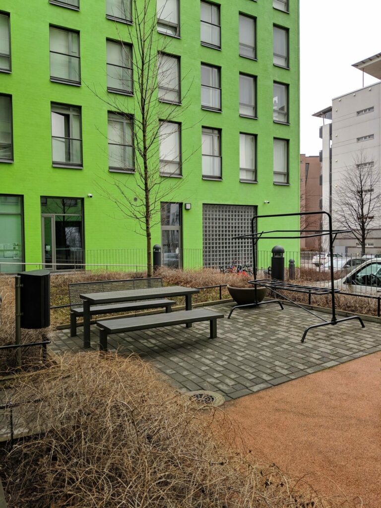 Exterior of the shelter painted a bright green