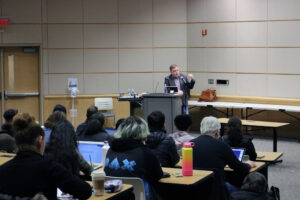 Tim Wise speaking in front of audience