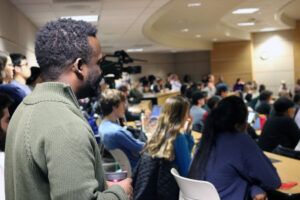 Audience members listen during Tim Wise address