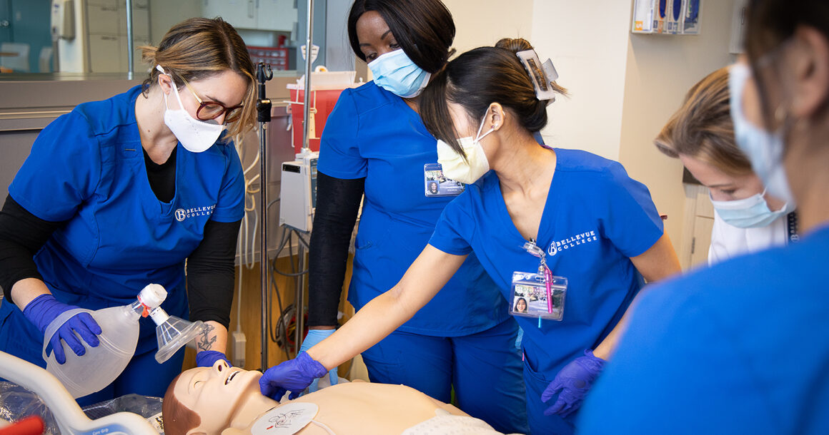 BC nursing students practice on a dummy in the lab.