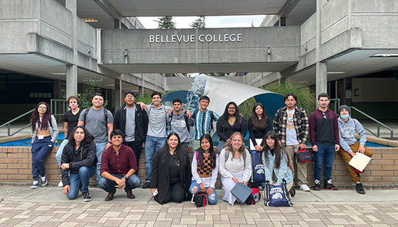 Group of students attending the Puente Orientation standing in front of a fountain