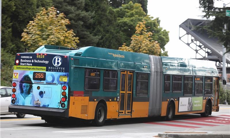 A bus drives through BC's campus.