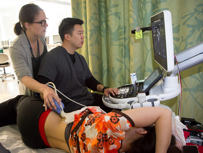 A BC student learns to use ultrasound technology.