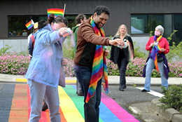 People celebrating the opening of the rainbow crosswalk on the BC campus