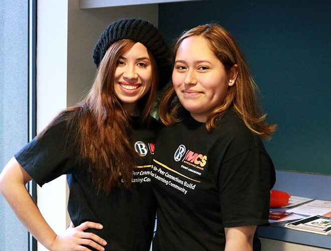 Students wear BC Multicultural Services T-shirts.