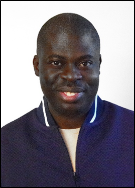 Head and shoulders picture of Saidi Lwanga who is looking directly at the camera with a smile and wearing a blue jacket.