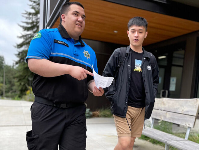 A BC Public Safety officer escorts a student on campus.