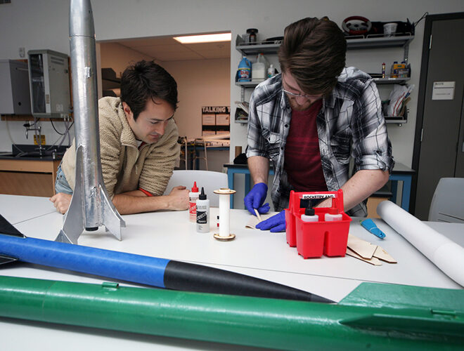 Two students work in a lab.