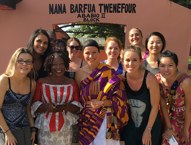 Study Abroad students cheerfully gather together.