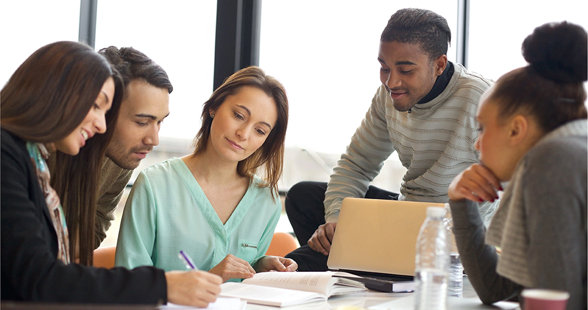 Students in a professional training course work together.