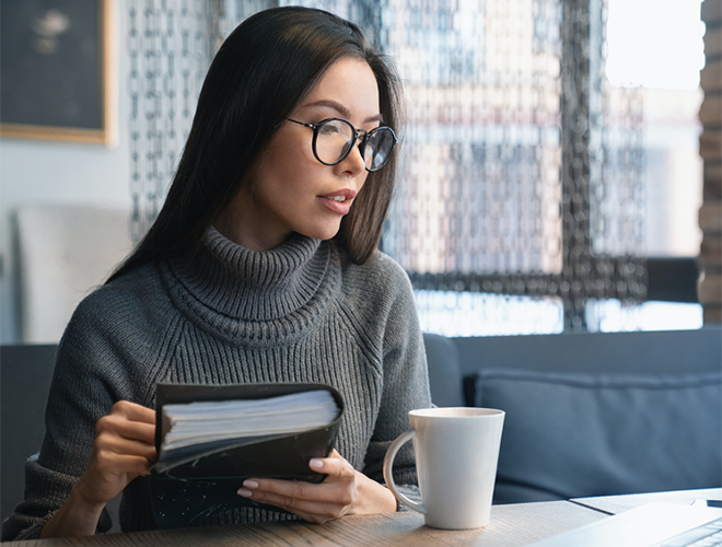 An entrepreneur consults her laptop.
