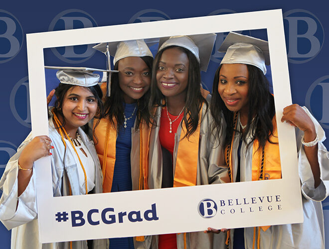 BC grads celebrate in their gowns.