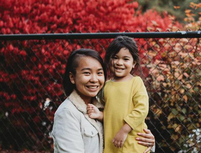 Mother and Daughter posing together.