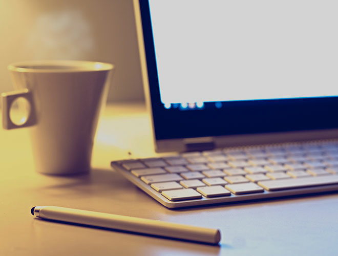 White Mug Beside Apple Keyboard