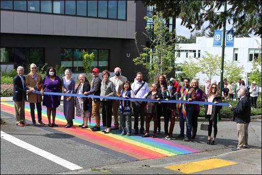 Ribbon cutting over the rainbow crosswalk