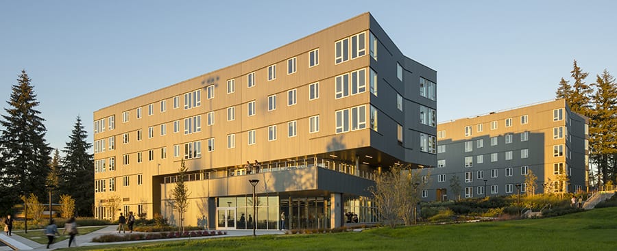 View of the Residence Hall in the evening sun with shadows from trees.