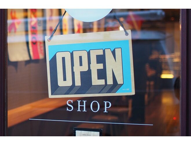 Image of an open sign in the door of a shop