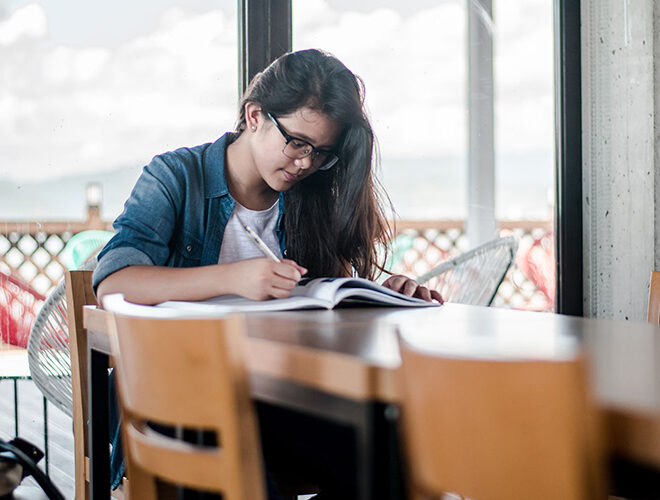 A student studies at a table.