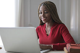 A student works on their laptop.