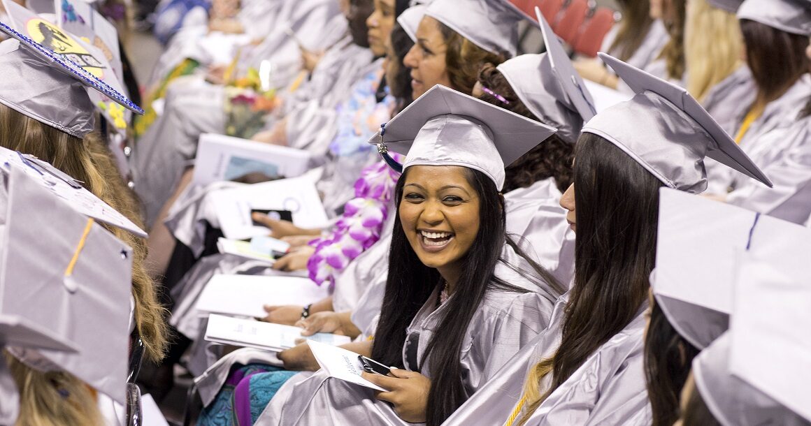A student laughs during the graduation ceremony