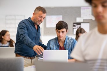 Instructor helping students