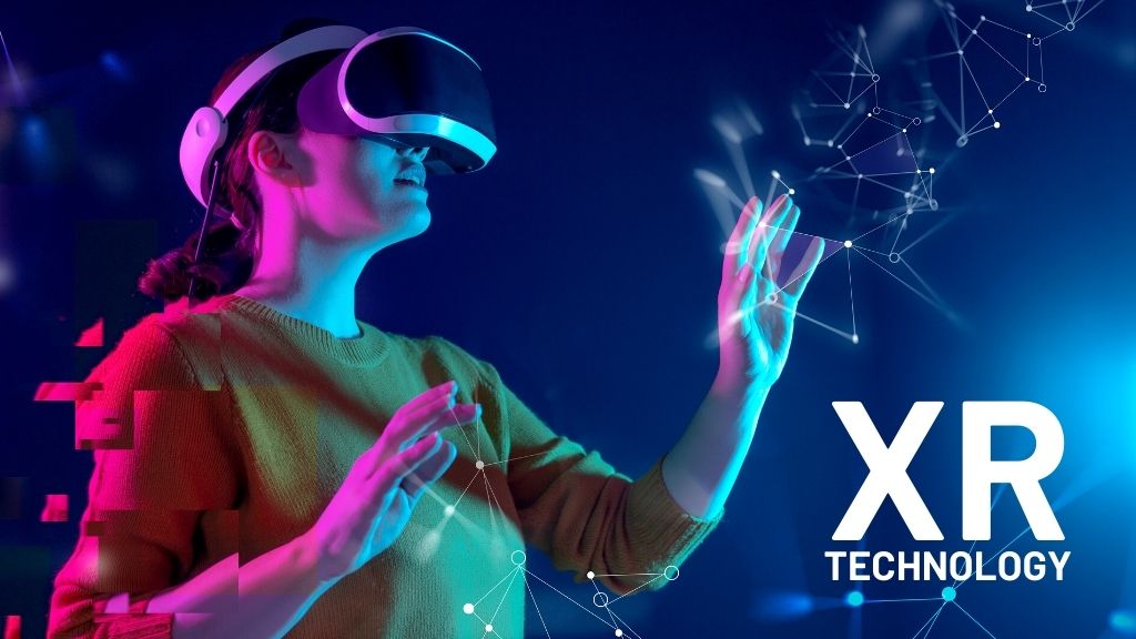 Woman wearing a VR website, reaching out to touch an abstract pattern; XR technology