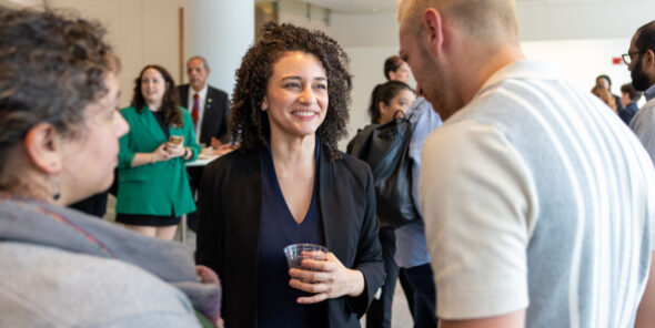 BC alumni talking with people at the IIDA awards ceremony