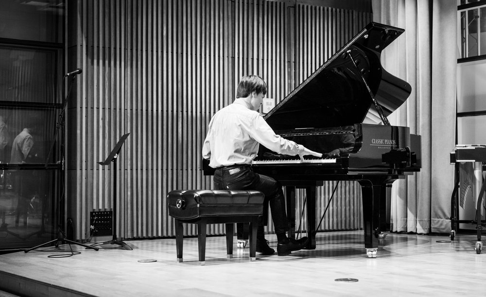 Person plays piano.