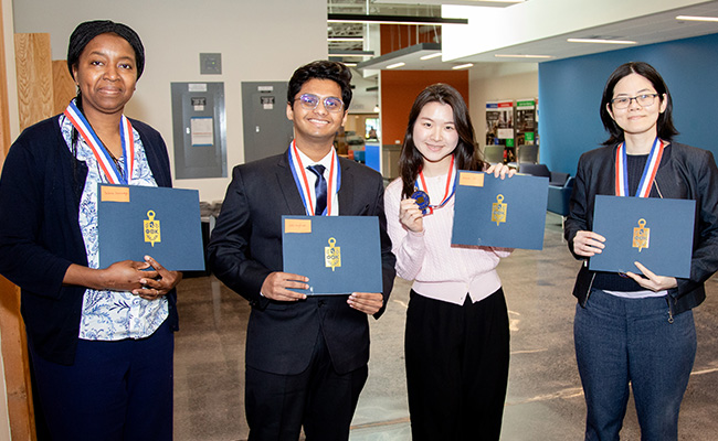 Sabine Sawadogo, Joel Varghese, Haim Ju, and Patama Gomutbutra at the All-Washington Academic Team Ceremony on April 24.