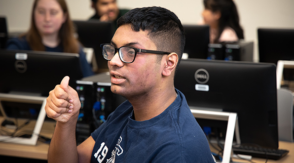 An OLS student works in the computer lab.