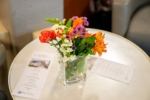 Vase of flowers on table. 