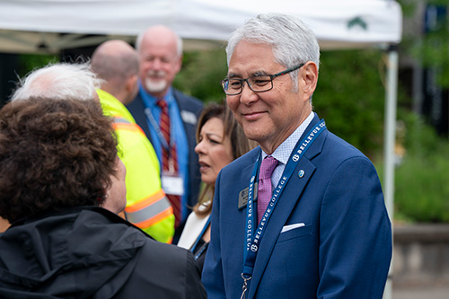 Man smiles at person.